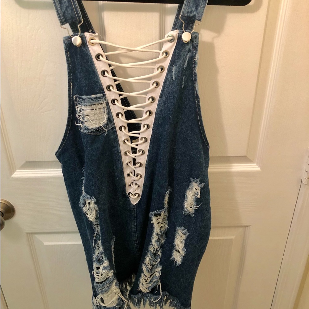 Trendy lace up denim overalls with rips!!